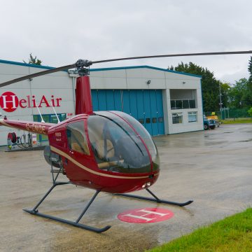 Beautiful New Robinson R22 Beta II helicopter with volcano red and gold paint scheme, with plush interior