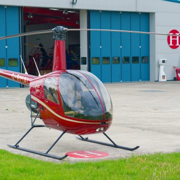 Beautiful New Robinson R22 Beta II helicopter with volcano red and gold paint scheme, with plush interior - front view