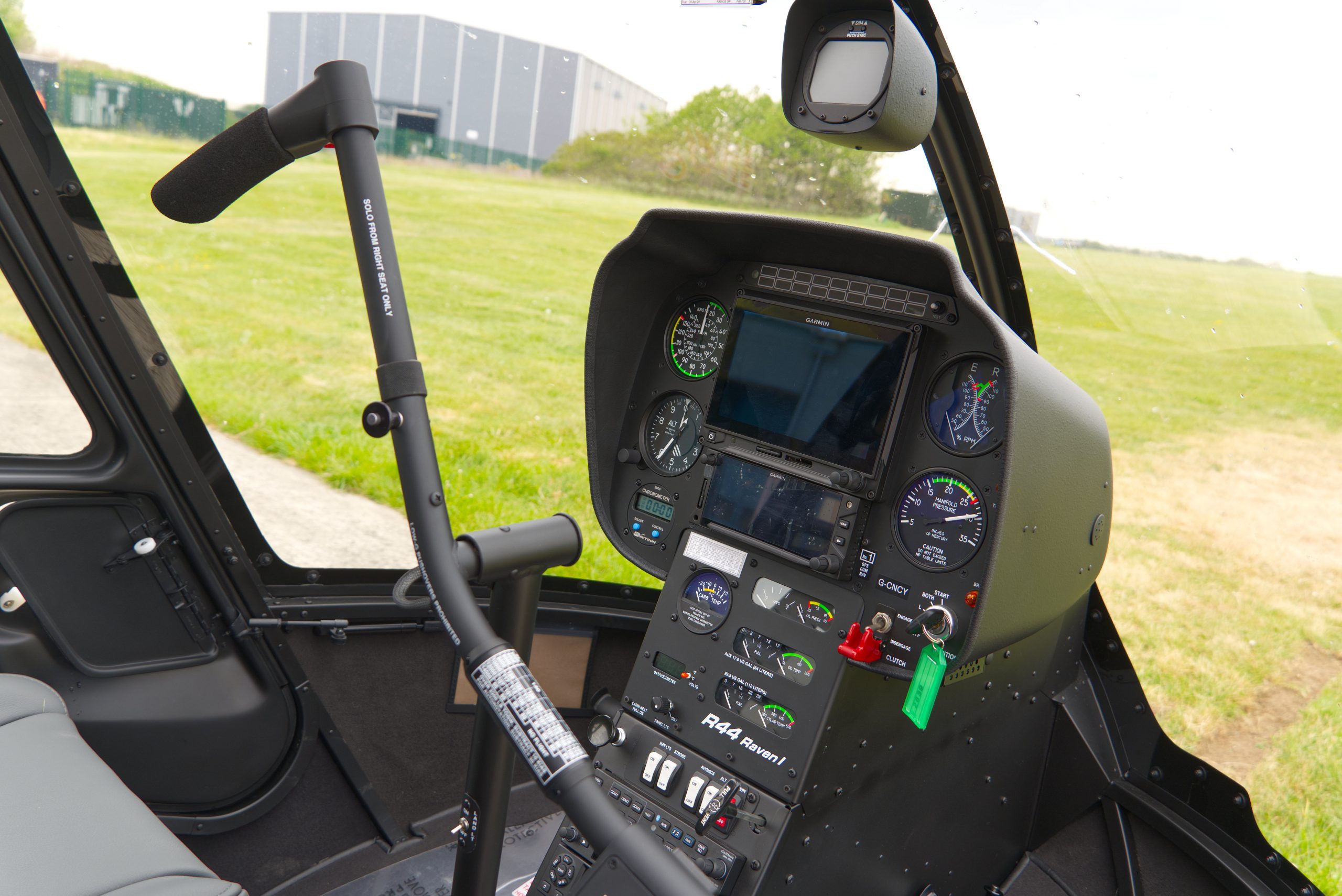 Beautiful New Robinson R44 Raven I helicopter with white and grey paint scheme, plush interior and impact resistant windshield
