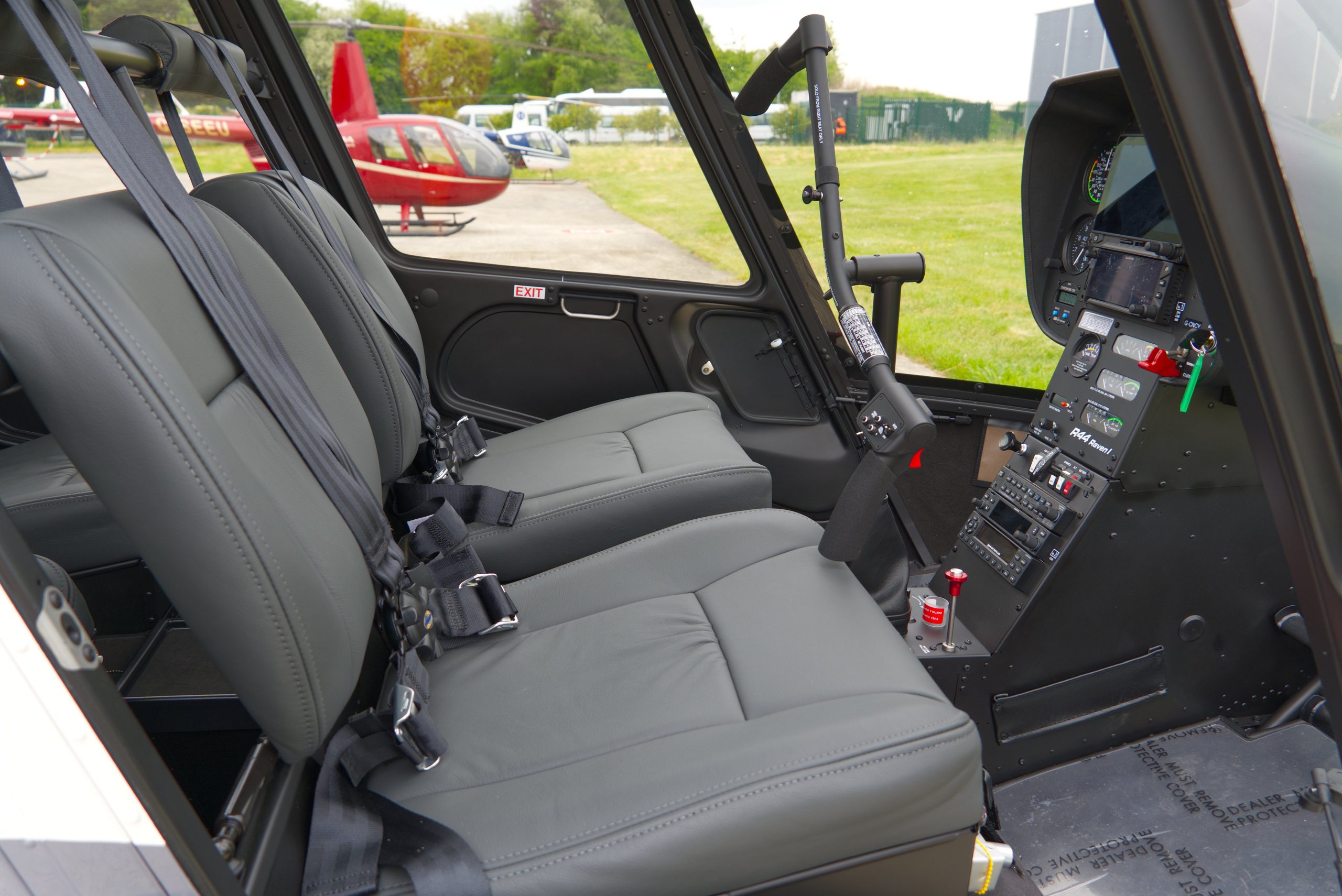 Beautiful New Robinson R44 Raven I helicopter with white and grey paint scheme, plush interior and impact resistant windshield