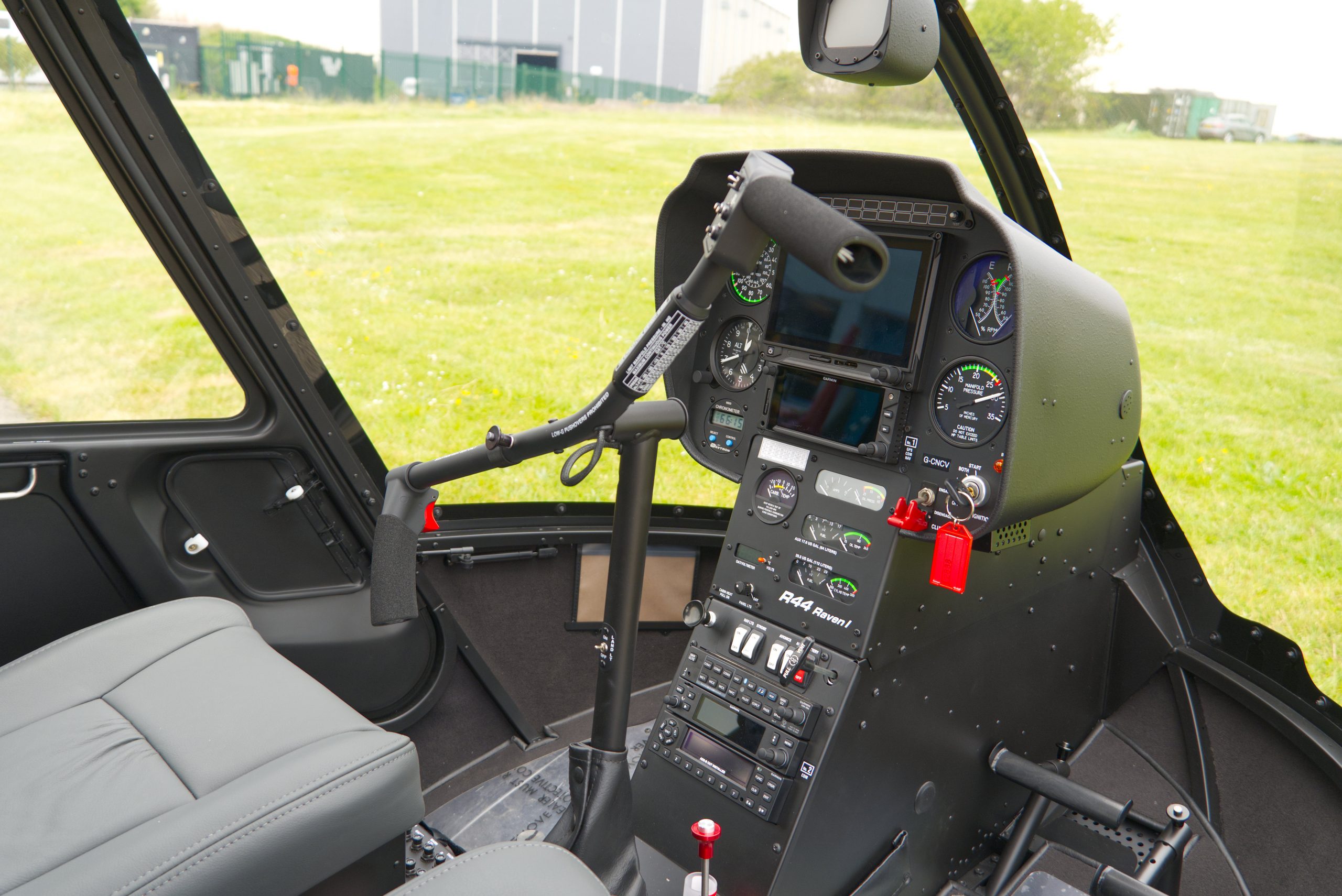 Beautiful New Robinson R44 Ravel I helicopter with white and grey paint scheme, plush interior and impact resistant windshield