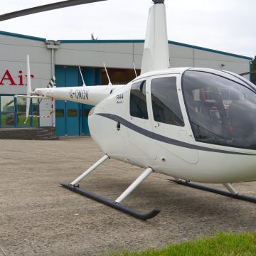 Beautiful New Robinson R44 Ravel I helicopter with white and grey paint scheme, plush interior and impact resistant windshield