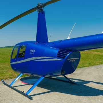 Beautiful Used Robinson R44 Raven II helicopter for sale with blue and silver paint scheme, plush grey interior, and great options specification.